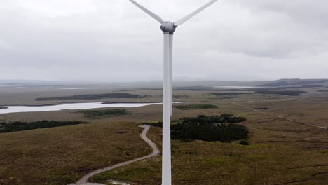 drone shot of a scottish wind turbine's tower, blades, motor and nacelle