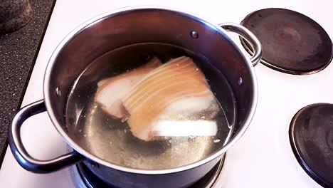 boiling delicious pork for use in soup - cooking pork cabbage soup