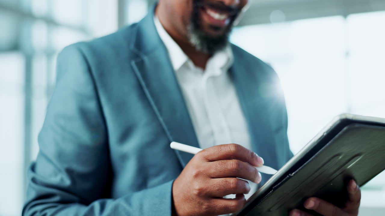 A businessman using a tablet with a digital pen