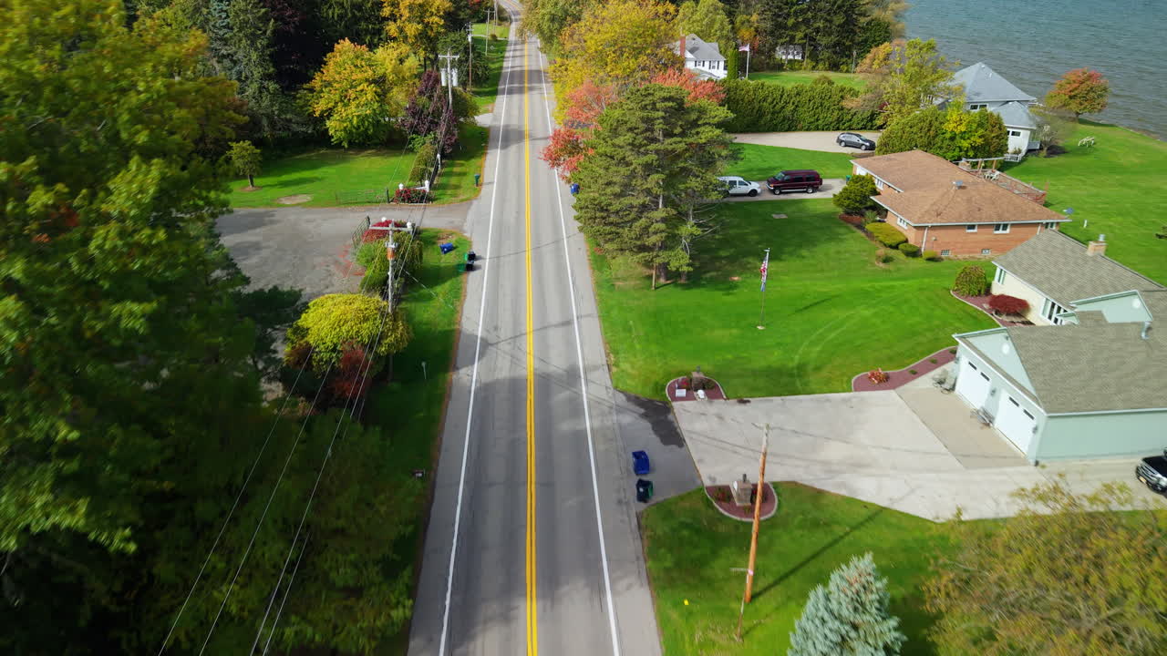 Aerial view of a road with trees and houses