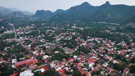 panoramic aerial shot of the magical town of tepoztlán surrounded by mountains