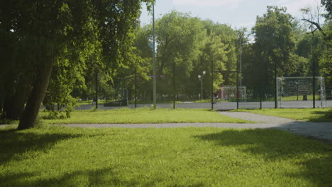 kids running through a park on a sunny day