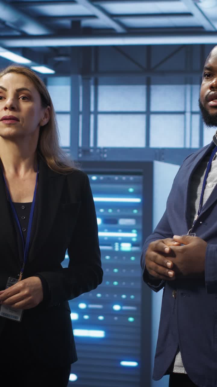 IT Professionals Discussing in Server Room