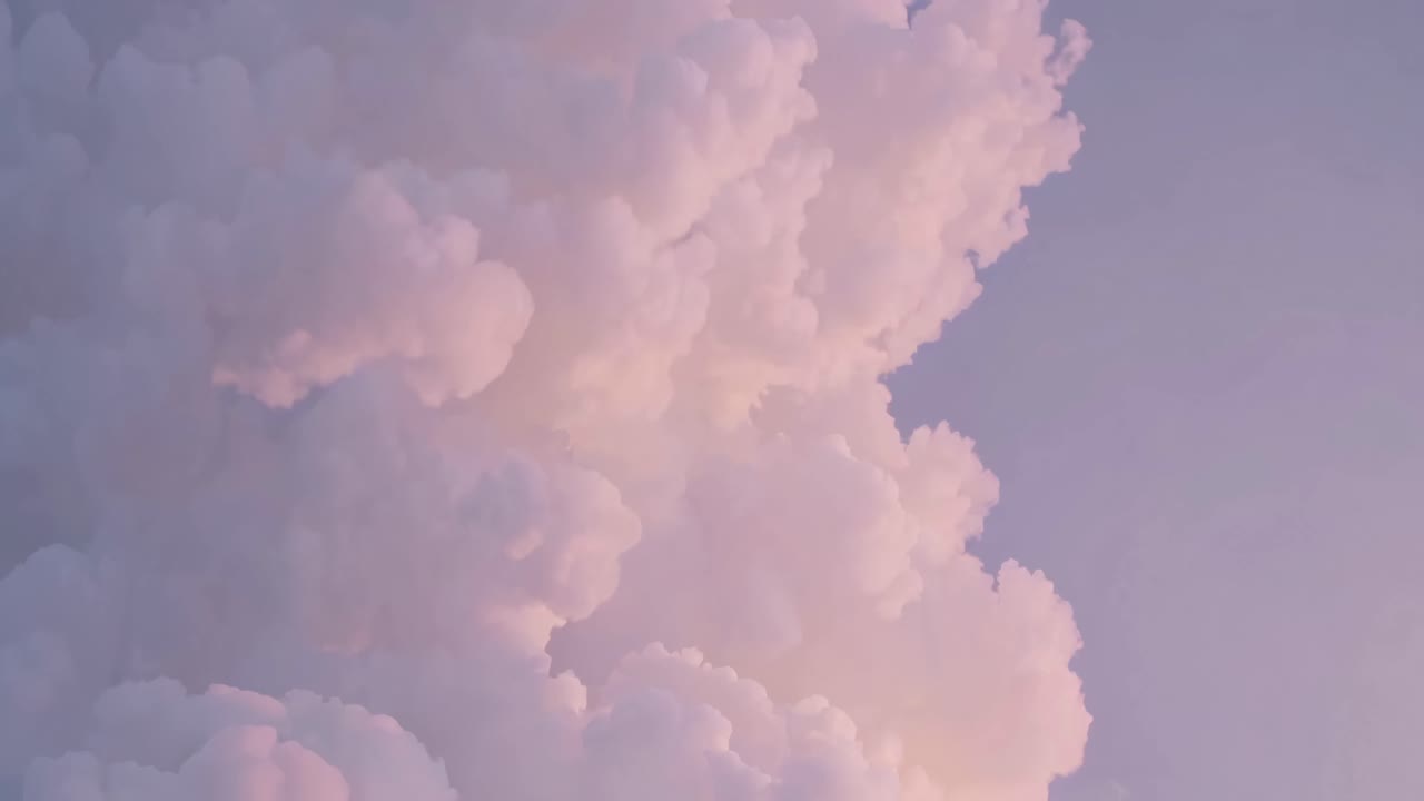 A dreamy, pastel-hued cloudscape captured from a low angle, ideal for a calming video backdrop