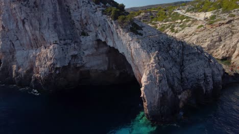 huge natural arch in greece during summer