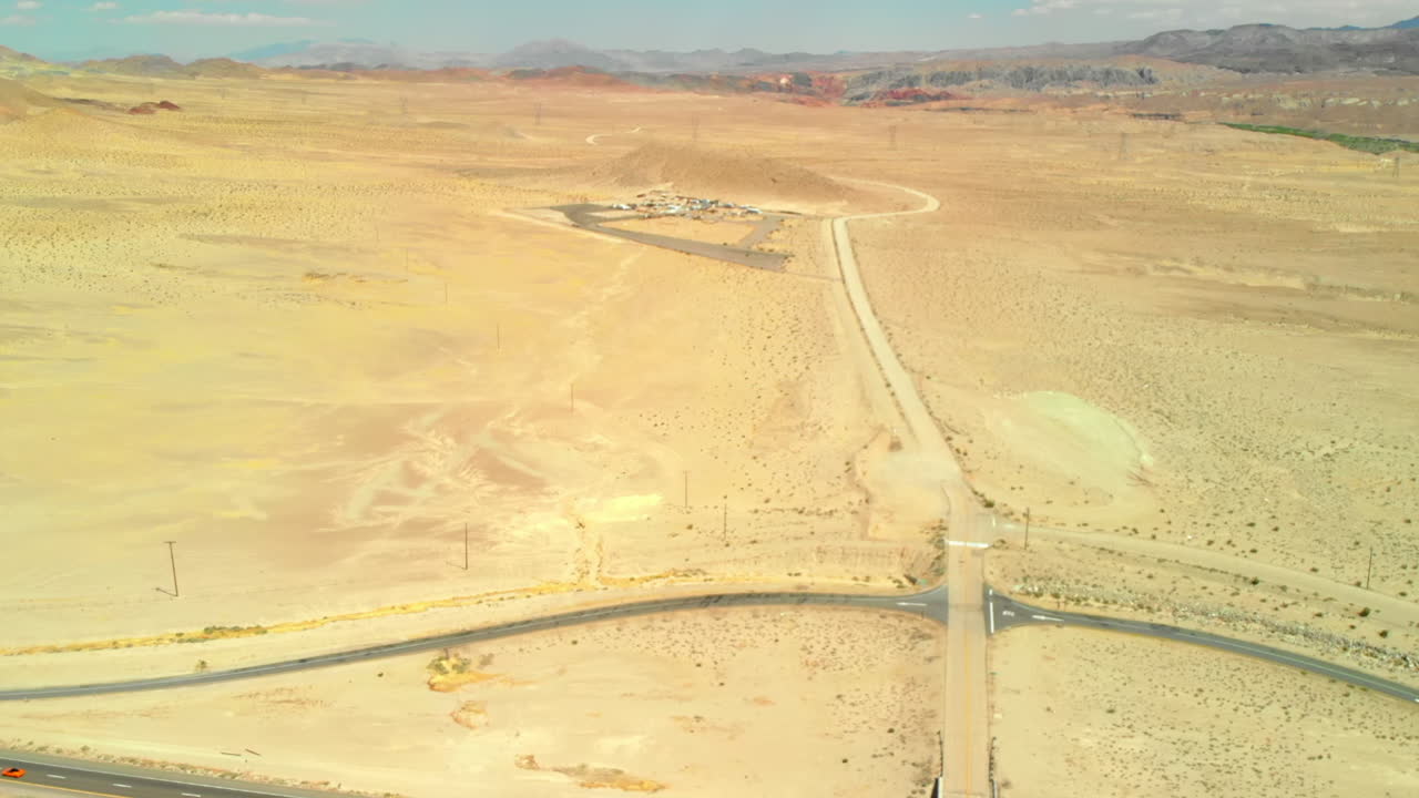 Aerial Flyover of Highway to Small Desert Community
