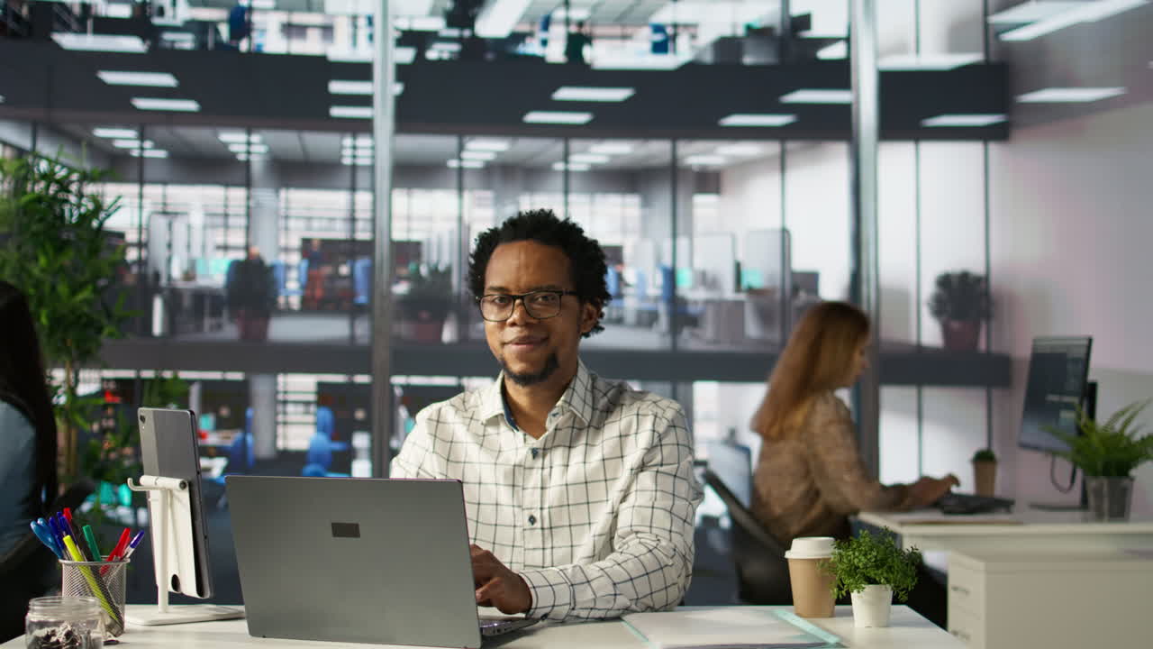 Office scene with employees working on computers