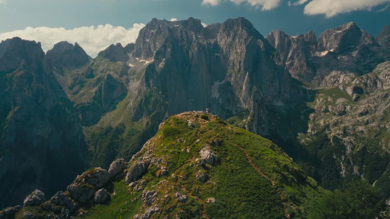 Hiker on Volusnica with Karanfili range, inspiring and tranquil scenery
