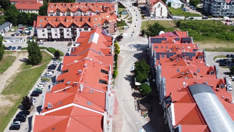 red rooftops of local downtown building in gizycko, aerial view