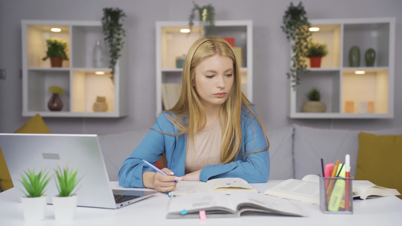 Female student looking at camera with negative and negative gesture.