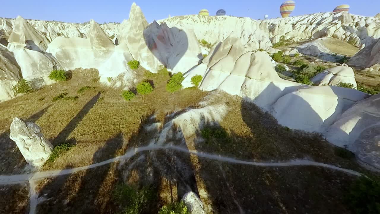 See the stunning landscape of Cappadocia’s valley from a hot air balloon at dawn, a photographer’s dream