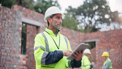 construction worker using a tablet at a construction site