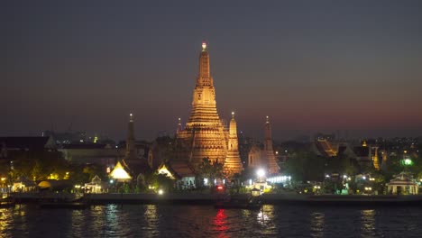 wat arun temple at night in bangkok, thailand