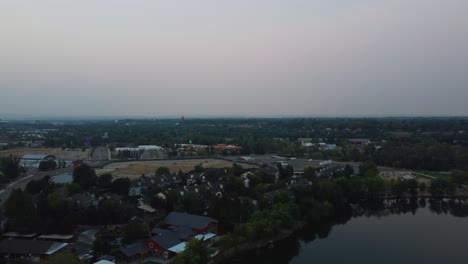 Flying-Over-Boise-River-Towards-The-Department-of-Transportation-Building-In-Boise,-Idaho