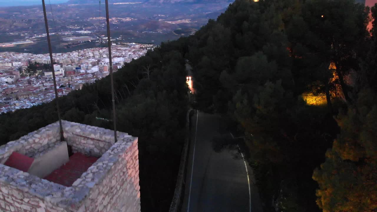 Jaen's Castle Saint Catalina Castle Spain shoot with a drone at 4k 24fps showing the exterior and the city from multiple points on a afternoon in December.
