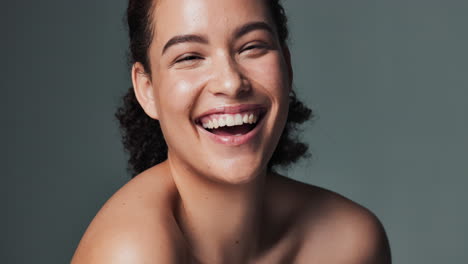 portrait of a smiling woman with curly hair
