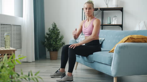 woman doing home workout on a couch