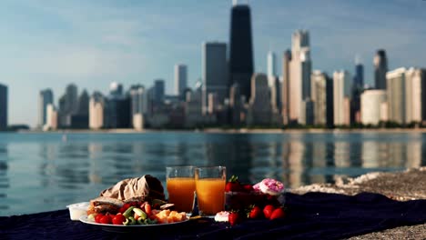 close-up view of fruits and juice on the shore of michigan lake in chicago, america in sunny bright day