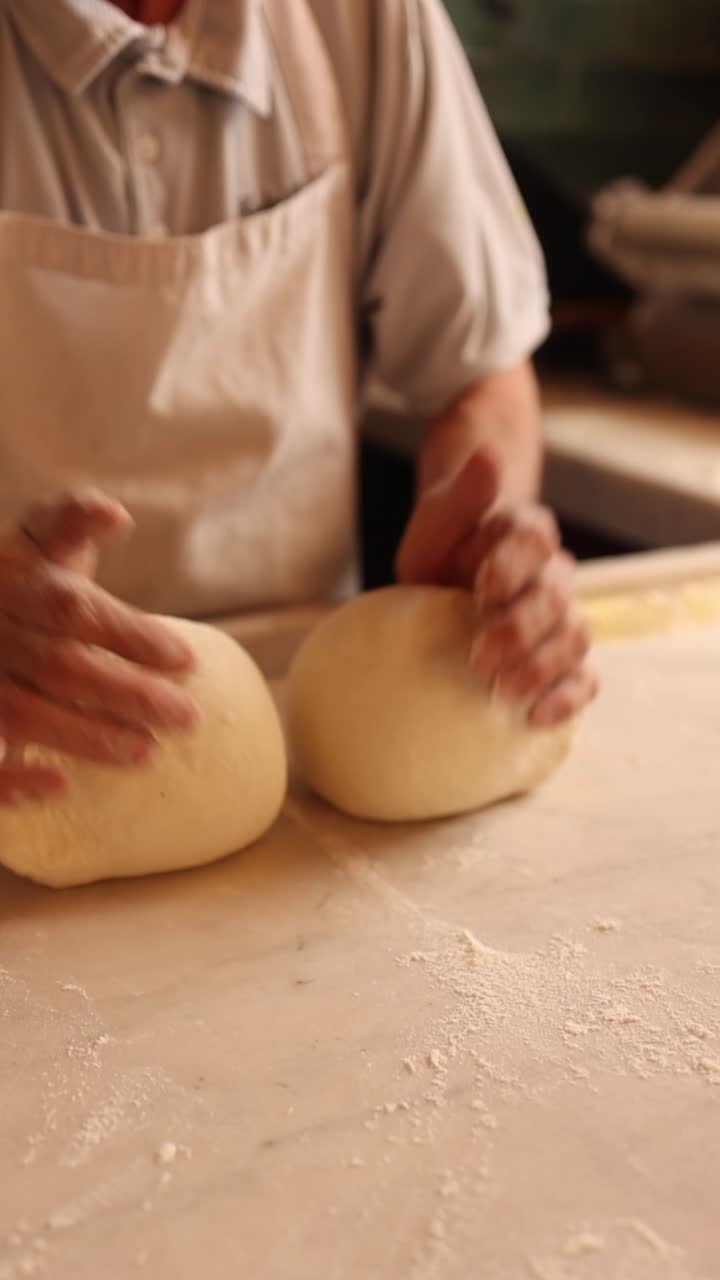 A baker kneading dough
