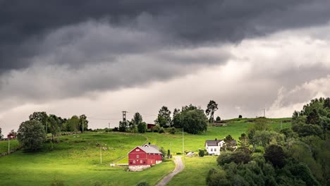 dark, stormy clouds passing over the remote norwegian farm