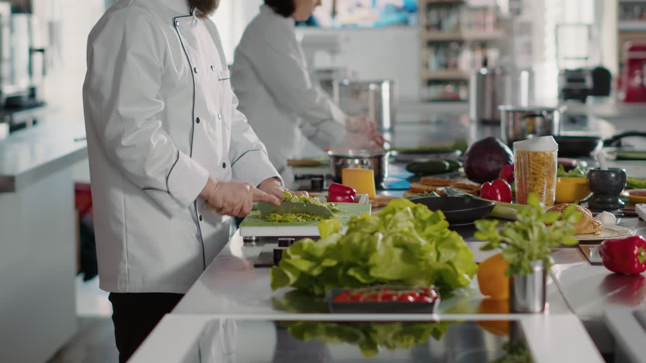 Authentic portrait of professional chef preparing celery for gourmet dish