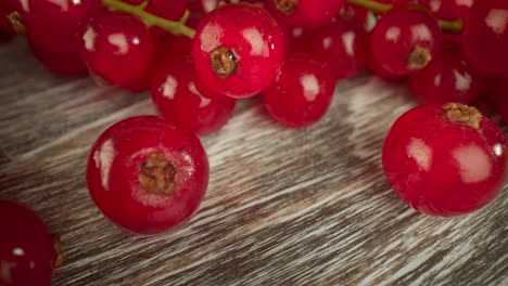 Super-close-macro-of-a-redcurrants-on-a-wooden-table.