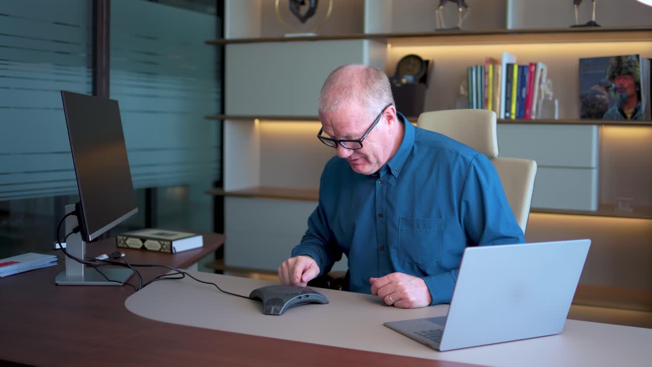 Caucasian Businessman Working In Office Connects To An Online Meeting, Realizes He Is On Mute
