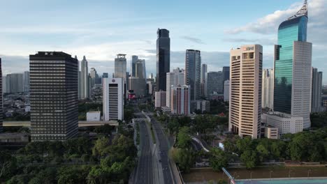 aerial jakarta view from above sudirman street in the morning with building and rush hours view