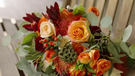 bouquet-sitting-on-rocking-bench-on-wooden-porch