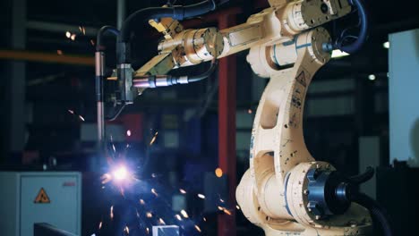 advanced robotic arm performing precision welding in an industrial setting, showcasing sparks and innovative technology in modern manufacturing processes
