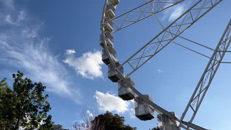 budapest, hungary - the budapest eye ferris wheel is spinning at deak square