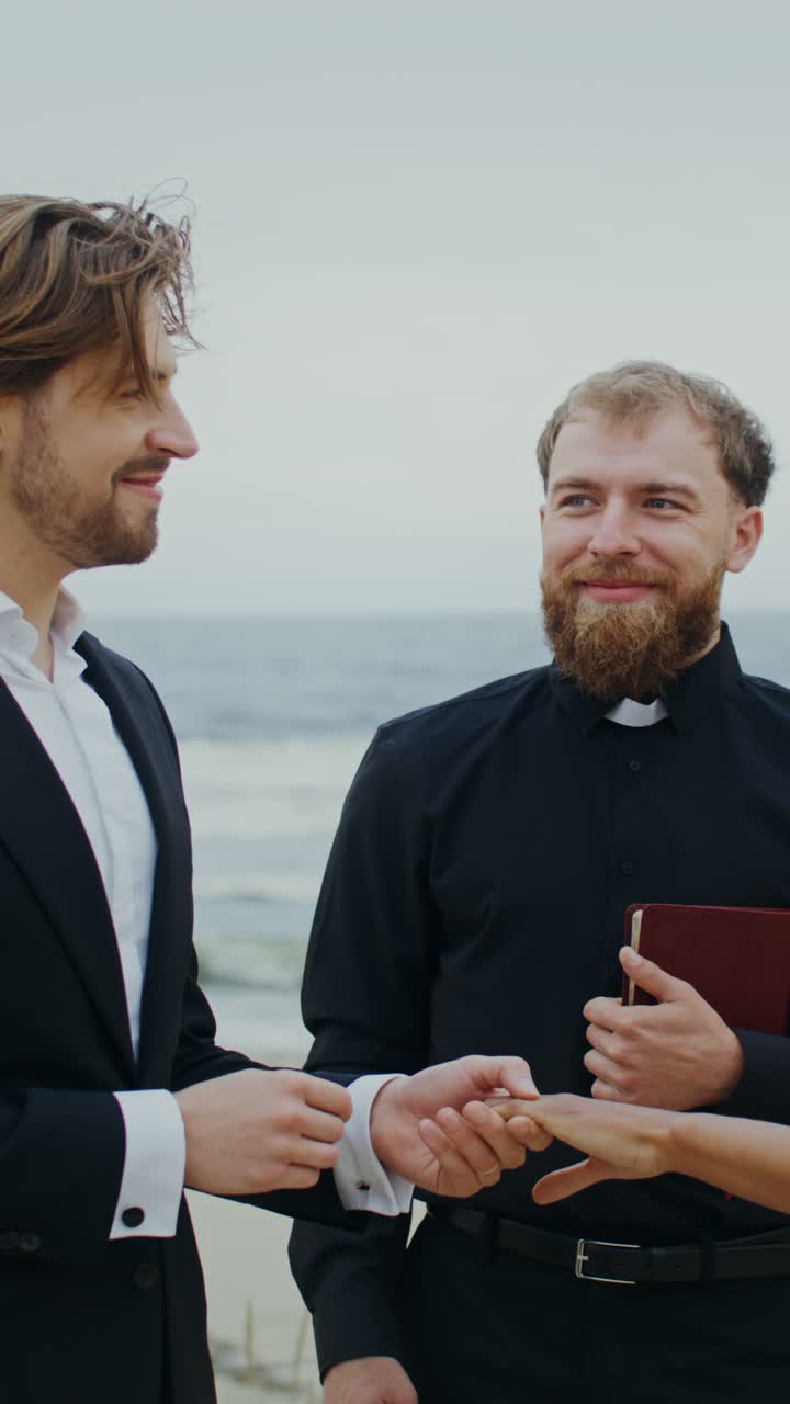 Gay couple wedding ceremony at the beach