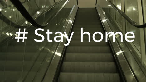 animation of the words #stay home written over an empty escalator.