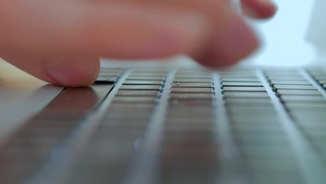 men's fingers print text on the keyboard, close -up, selective focus, chamber movement