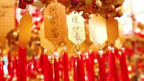 hanging golden bells with red tassels in temple