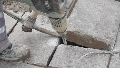 repairing pavement with jackhammer and power tools