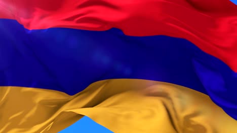 armenian flag waving at wind in slow with blue sky, loop