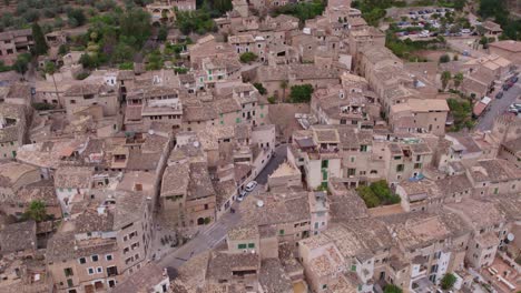 Flying-over-famous-city-Fornalutx-Mallorca-Spain-during-day-time,-aerial