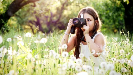 girl photographer of twelve years takes pictures of nature