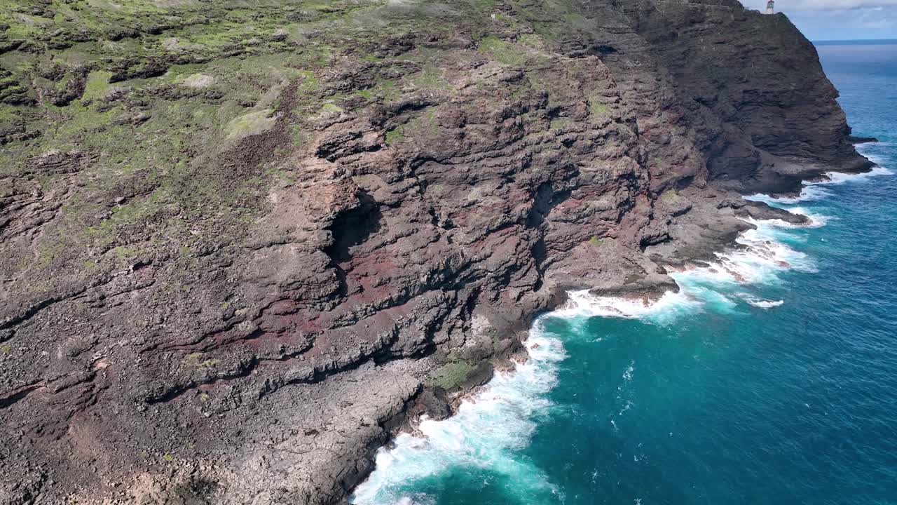 Hawaii's coast is a canvas of perilous beauty, with towering white waves and volcanic rock formations