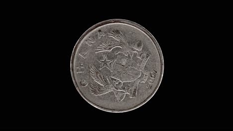 ghana 2007 20 pesewas coin obverse with coat of arms rotating on black background
