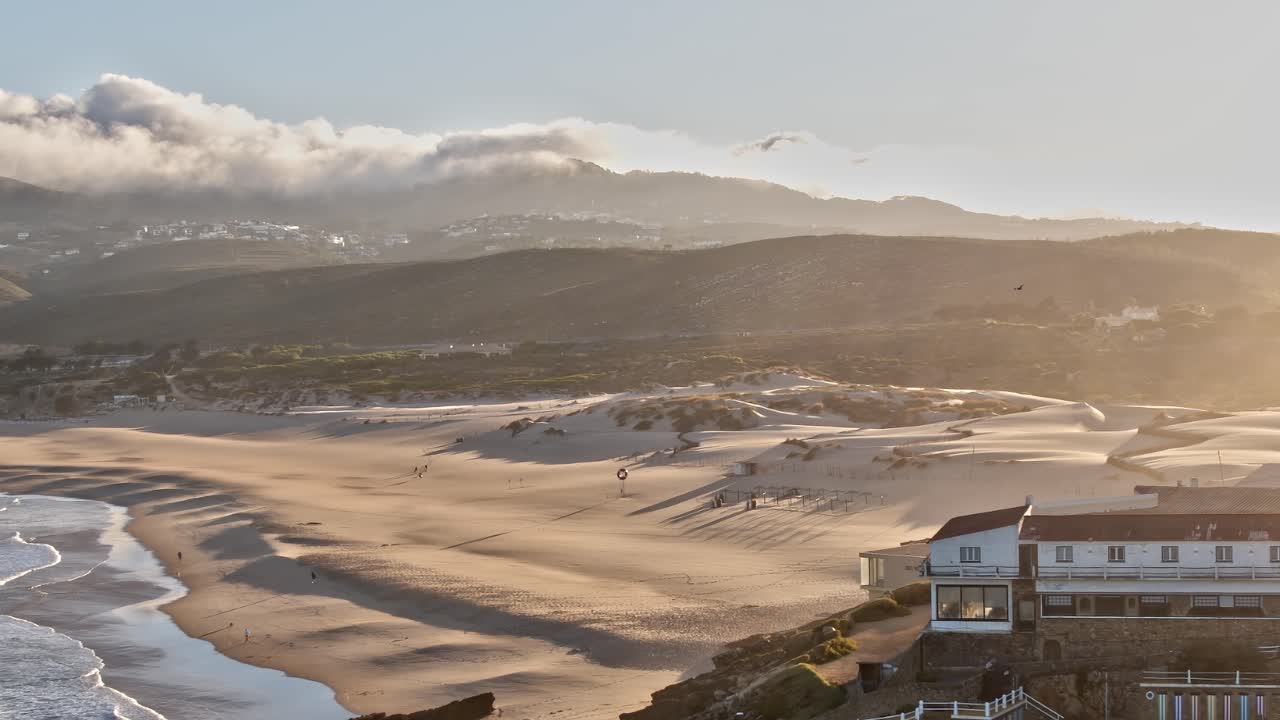 Visit to sandy beach near coast in Portugal during golden hour