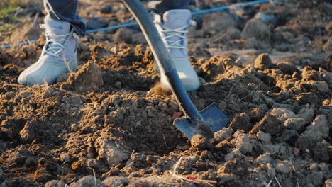 The-Gardener-Digs-Up-Soil-In-His-Vegetable-Garden-Spring-Work-In-The-Garden