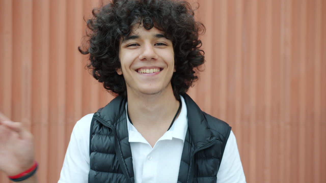 Smiling Teenager Waving