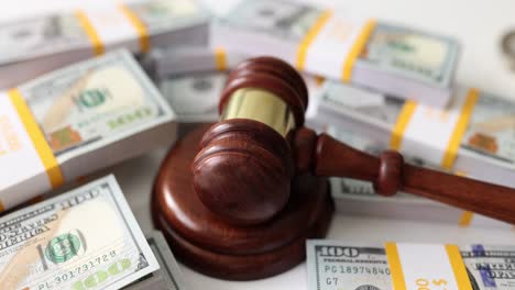 gavel and stacks of hundred dollar bills