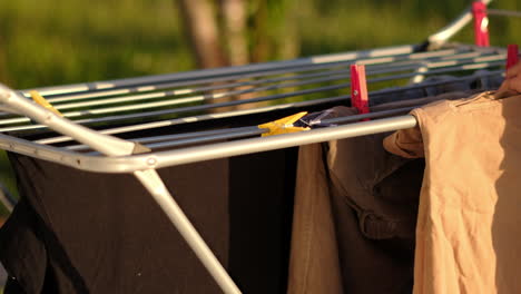 Hanging-Laundry-to-Dry-on-Outdoor-Clothesline-in-Sunlight