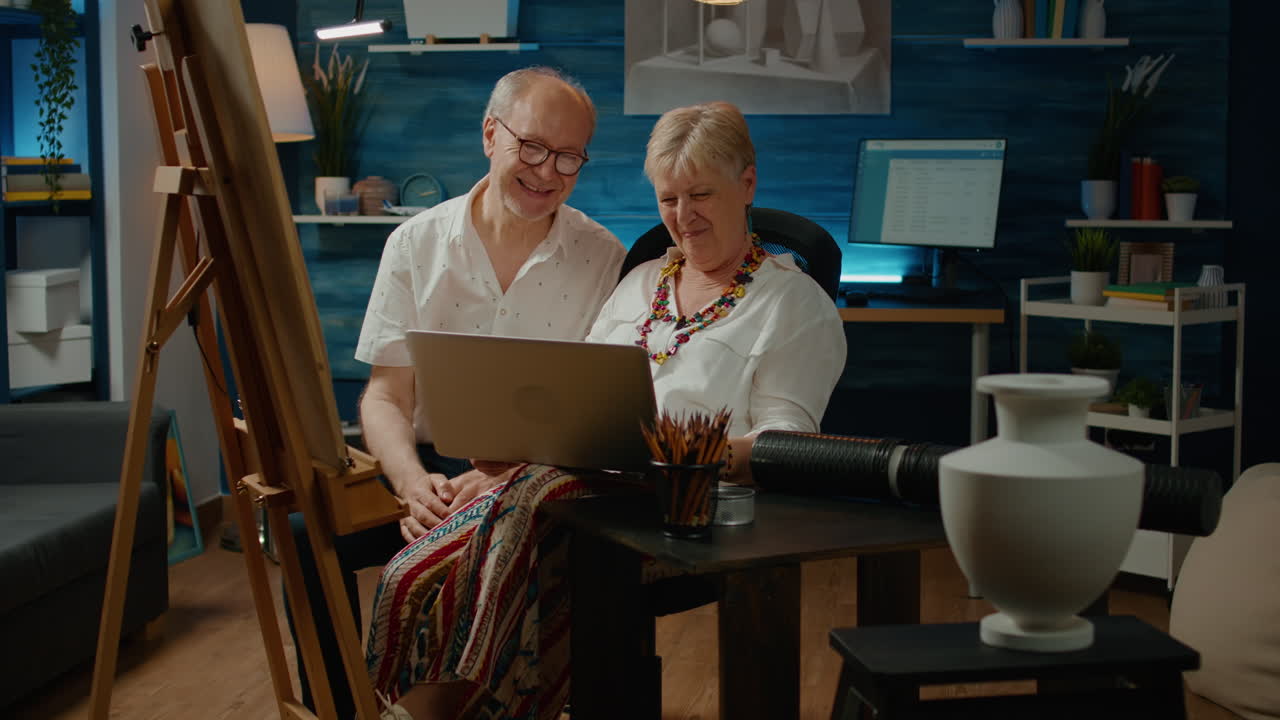 Old man and woman doing teamwork to draw vase artwork