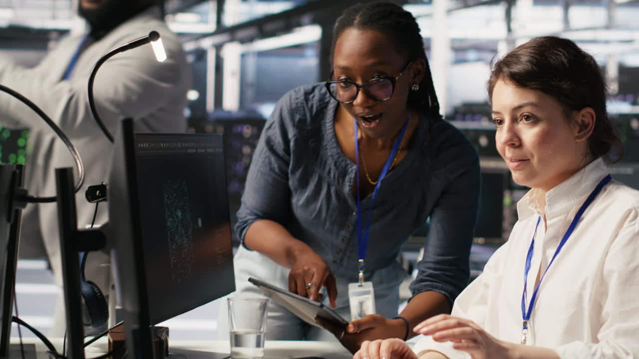 Vertical video Smiling technicians doing fist bump in AI data center