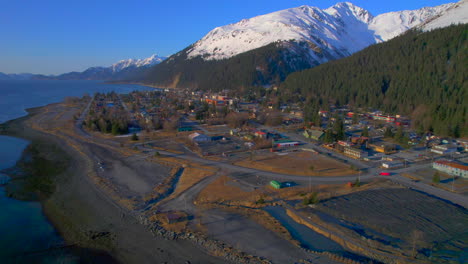 High-aerial-view-of-downtown-Seward-Alaska-with-mountains-at-sunrise