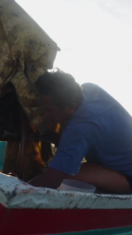 man fishing on a boat